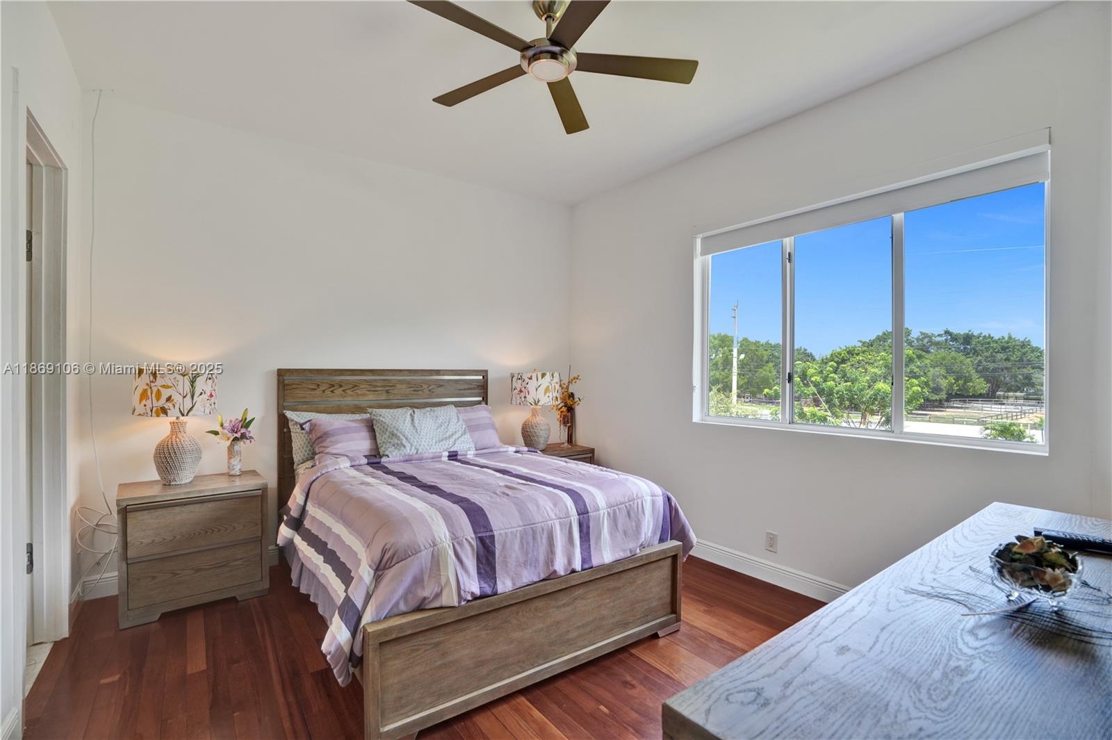 2691 Southwest 139th Terrace Davie, FL 33330 - Photo 44 of 55 a bedroom with a bed and a window