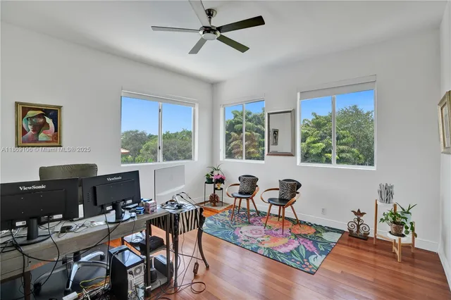 a bathroom with a granite countertop sink a toilet and a mirror