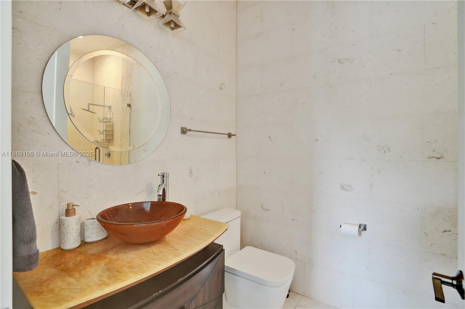 2691 Southwest 139th Terrace Davie, FL 33330 - Photo 46 of 55 a bathroom with a sink and a mirror