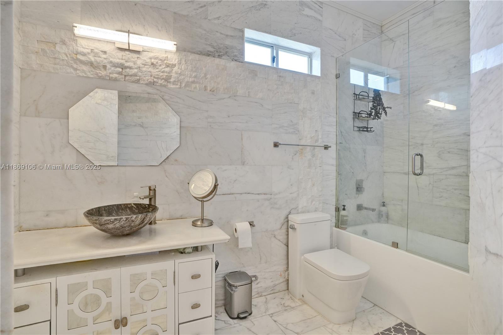 2691 Southwest 139th Terrace Davie, FL 33330 - Photo 48 of 55 a bathroom with a granite countertop toilet sink and shower