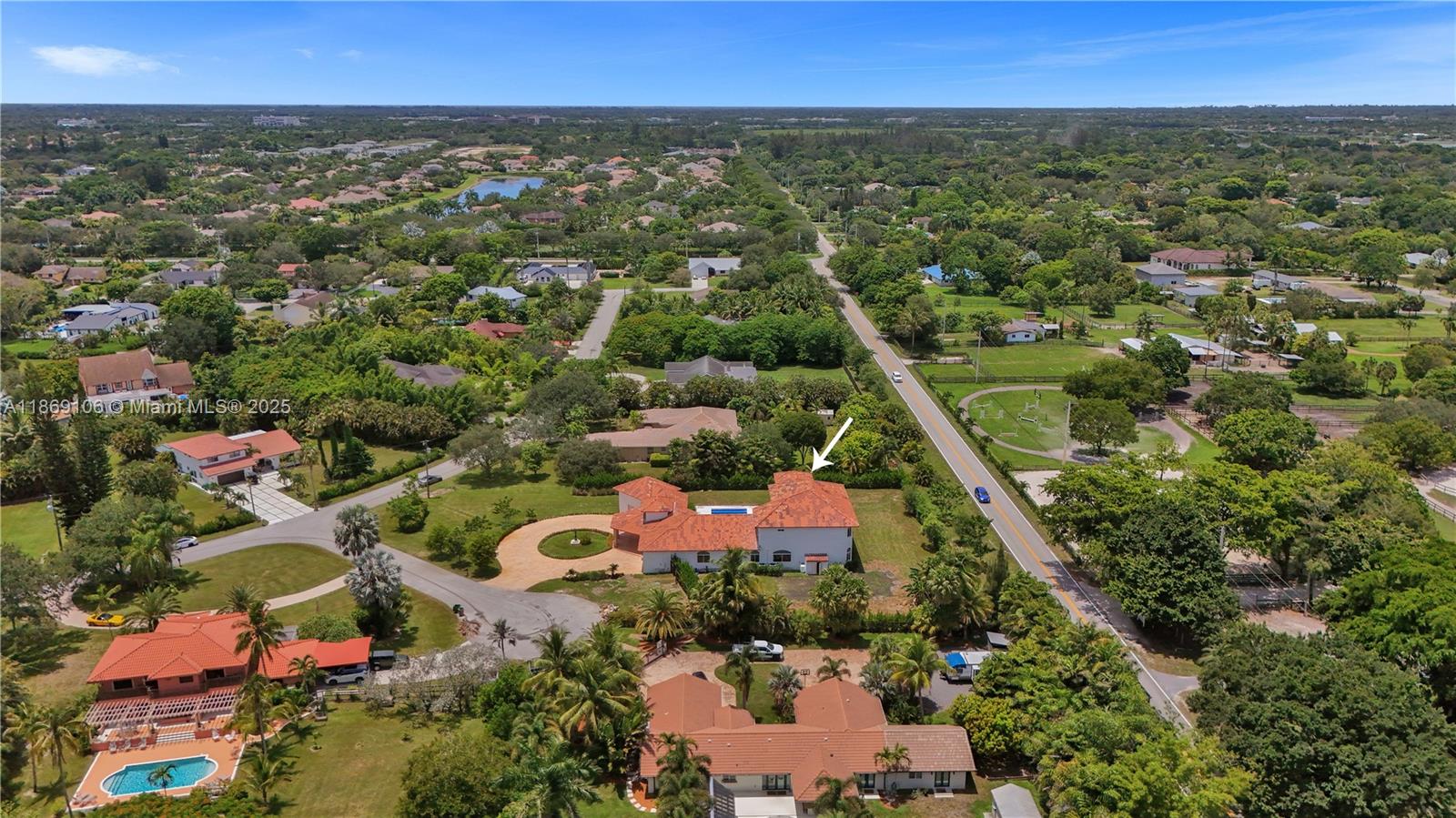 2691 Southwest 139th Terrace Davie, FL 33330 - Photo 54 of 55 an aerial view of residential houses with outdoor space and trees