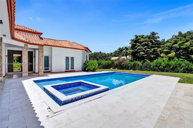 a view of a pool with a patio