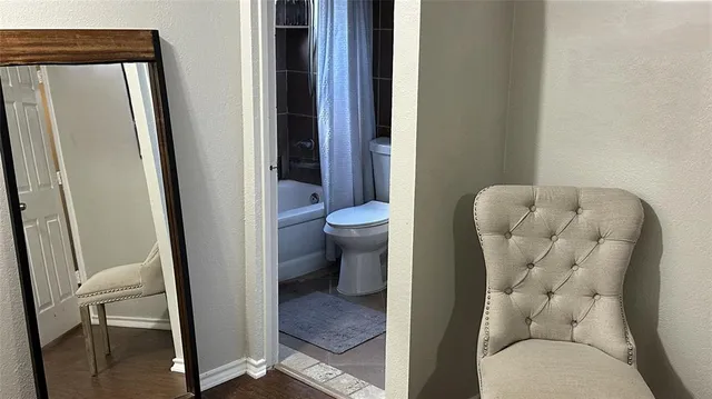 a bathroom with a toilet and a sink