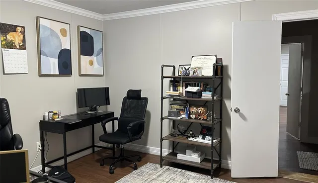 a view of a workspace with furniture and closet