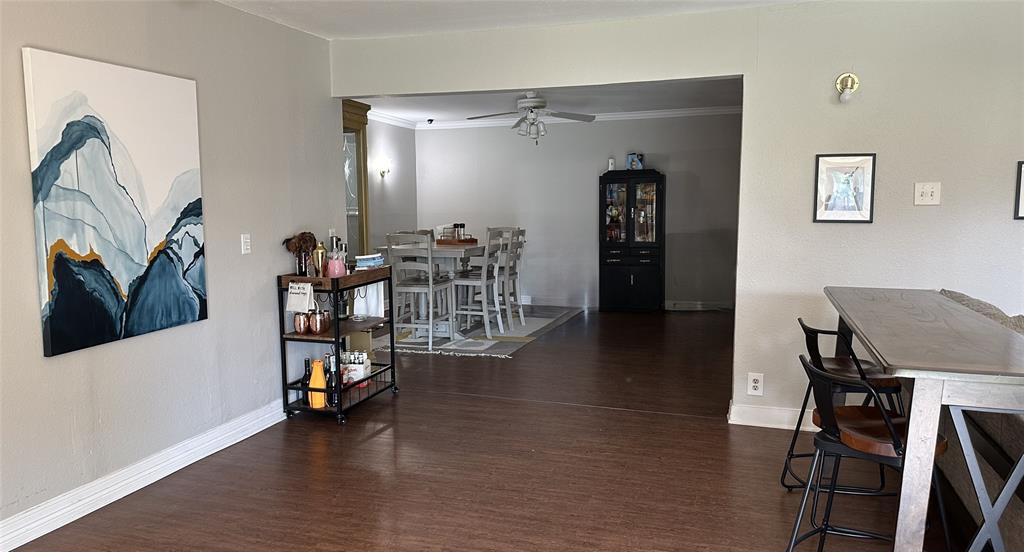 13533 Emeline Street Farmers Branch, TX 75234 - Photo 5 of 29 a view of a workspace with furniture and wooden floor