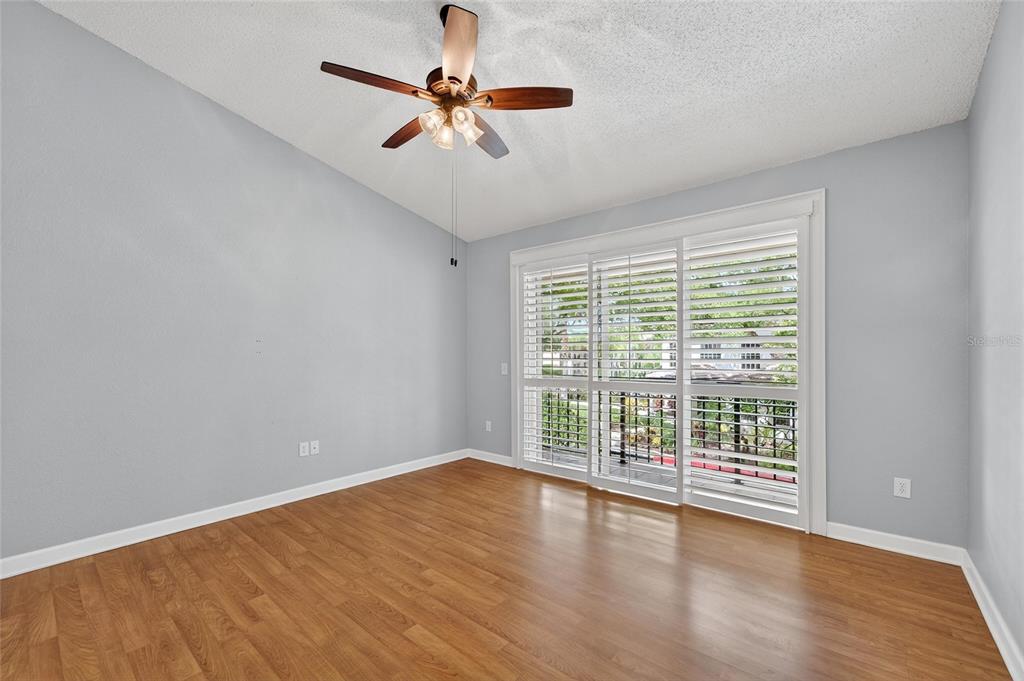 820 Normandy Trace Road Tampa, FL 33602 - Photo 17 of 49 a view of an empty room with wooden floor and a window