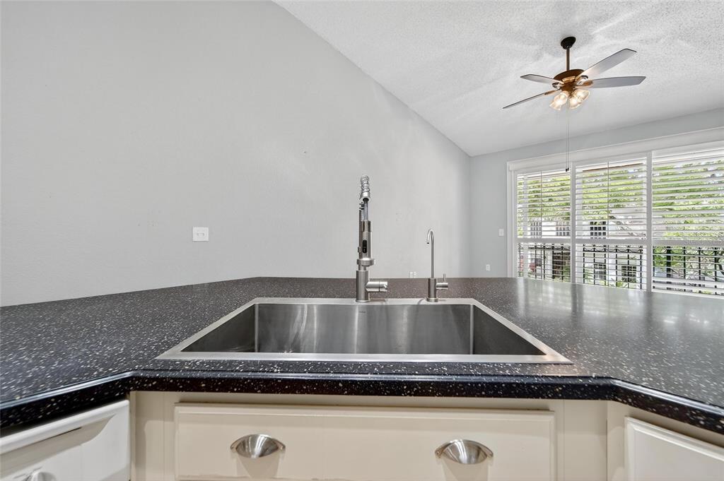 820 Normandy Trace Road Tampa, FL 33602 - Photo 26 of 49 a close view of a sink a counter space and a ceiling fan