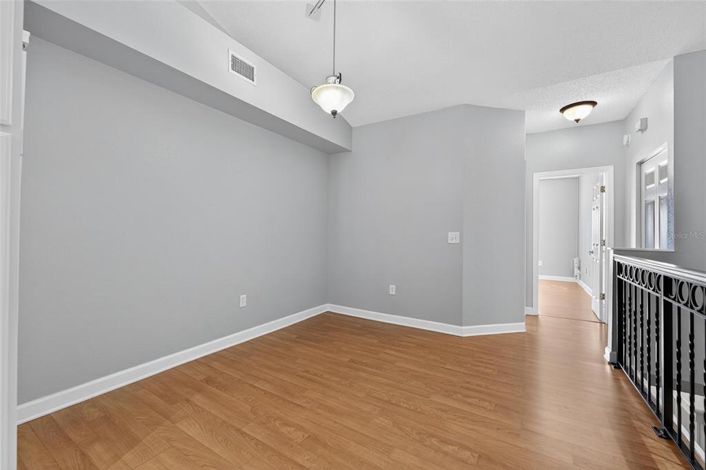 820 Normandy Trace Road Tampa, FL 33602 - Photo 27 of 49 a view of a room with wooden floor and white walls