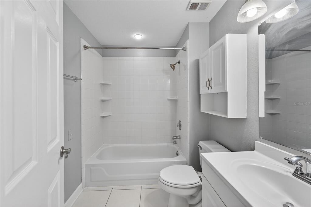 820 Normandy Trace Road Tampa, FL 33602 - Photo 30 of 49 a bathroom with a sink toilet and shower