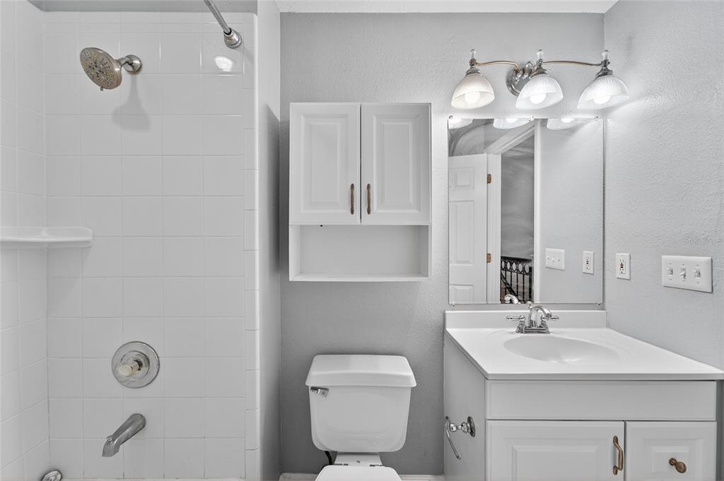 820 Normandy Trace Road Tampa, FL 33602 - Photo 32 of 49 a bathroom with a sink a toilet and a mirror