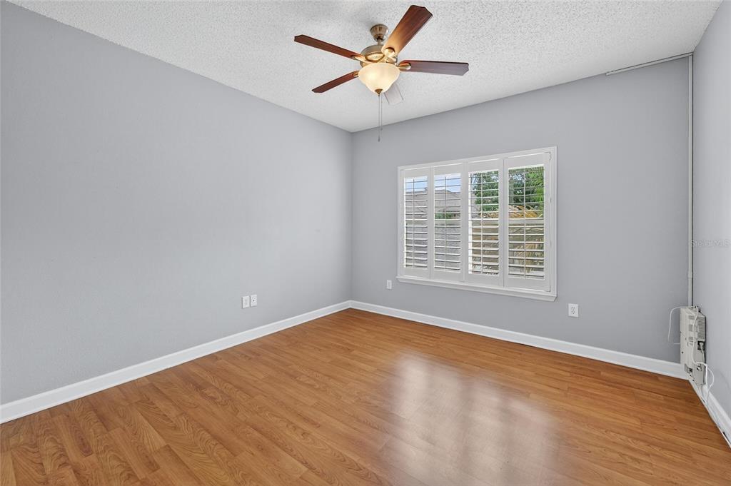 820 Normandy Trace Road Tampa, FL 33602 - Photo 33 of 49 wooden floor in an empty room with a window