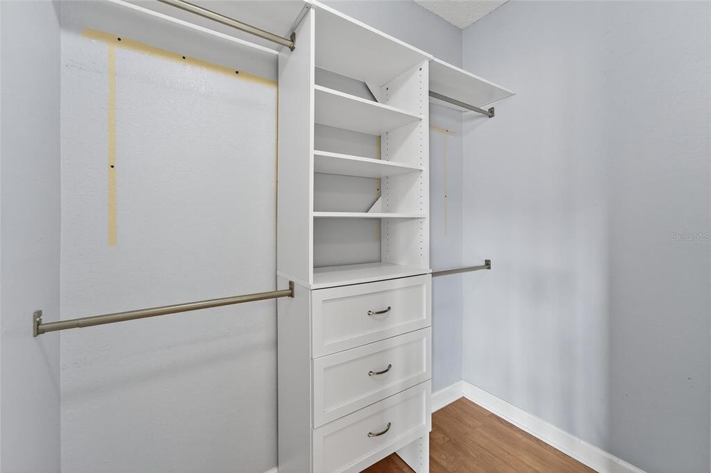 820 Normandy Trace Road Tampa, FL 33602 - Photo 36 of 49 a view of walk in closet with empty racks