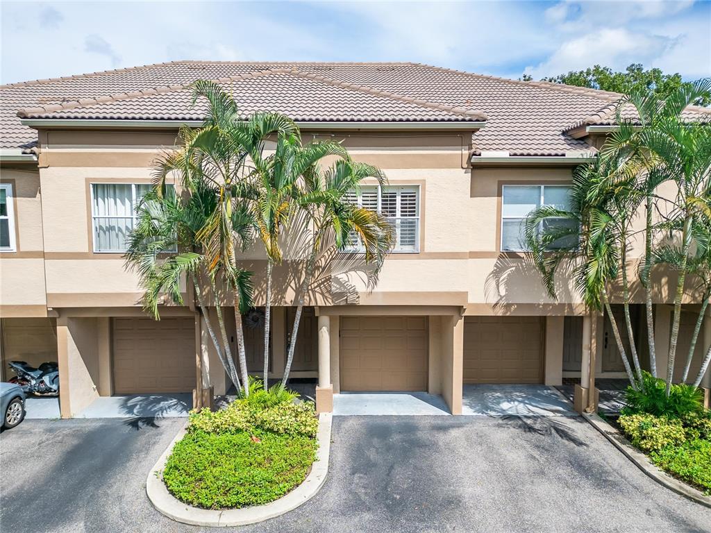 820 Normandy Trace Road Tampa, FL 33602 - Photo 46 of 49 a front view of a house with a garden
