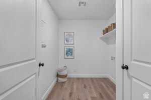 907 West Bright Ridge Ln Street, Unit 1430 St. George, UT 84790 - Photo 15 of 19 Dedicated utility space featuring wood-finish flooring, crisp white walls, and a recessed ceiling light