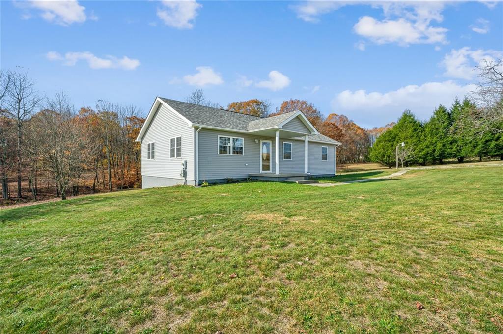 133 Ulery Road Acme, PA 15610 - Photo 3 of 38 a view of a house with a big yard