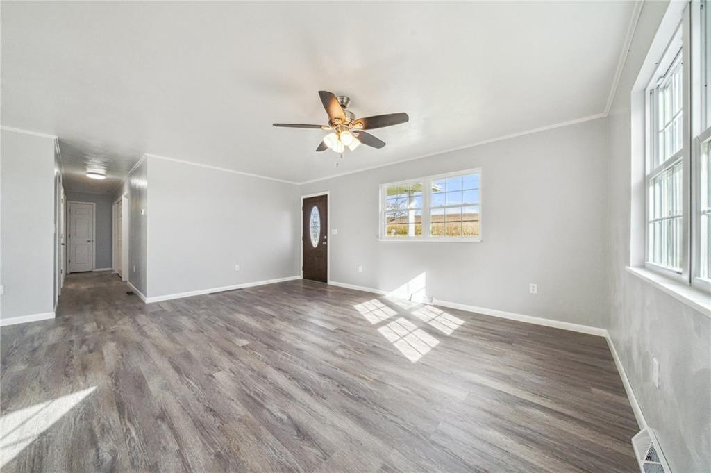 133 Ulery Road Acme, PA 15610 - Photo 7 of 38 wooden floor in an empty room with a window
