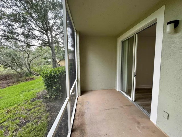 a view of porch with green space