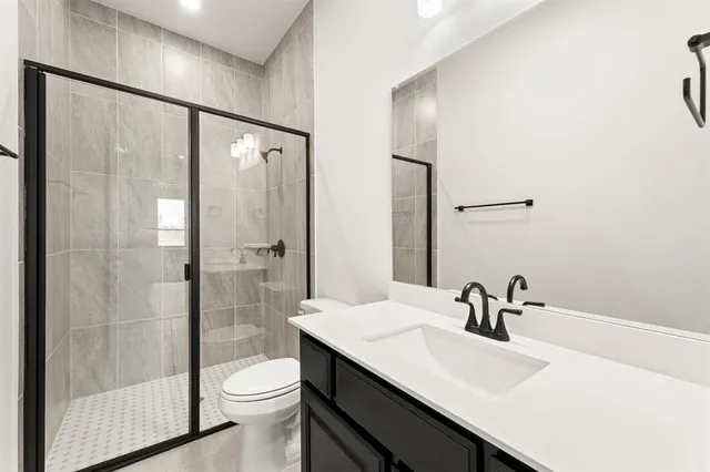 an empty room with wooden floor and a window