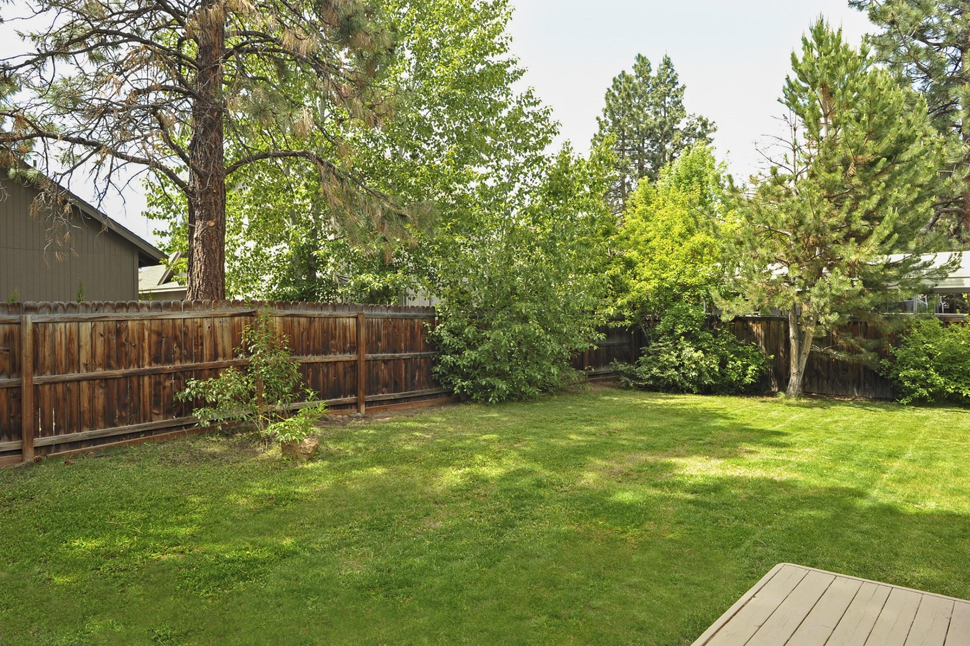 19834 Powers Road Bend, OR 97702 - Photo 12 of 22 Yard features towering pines and established foliage.