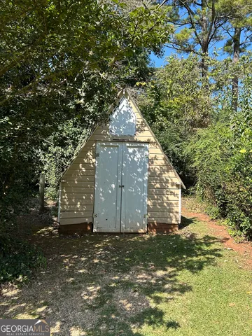 a view of a chairs and table in the patio