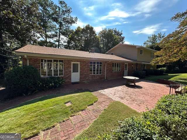 a view of a livingroom with furniture and a window