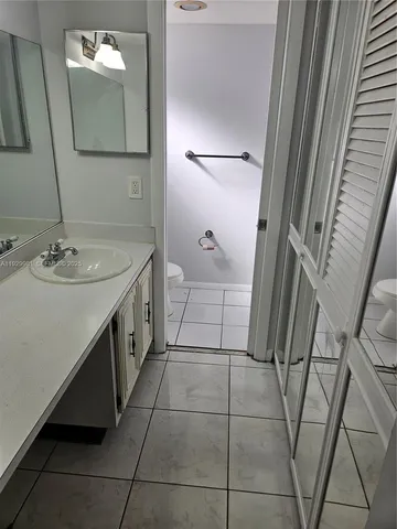 a bathroom with a sink and mirror