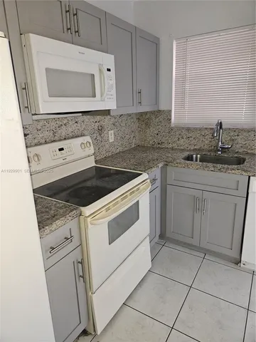 a bathroom with a sink a toilet and a bathtub