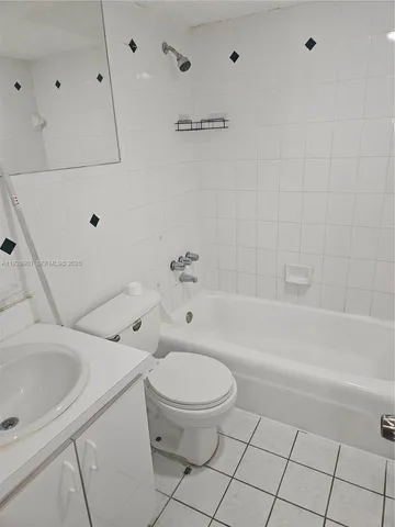 a bathroom with a bathtub and a toilet