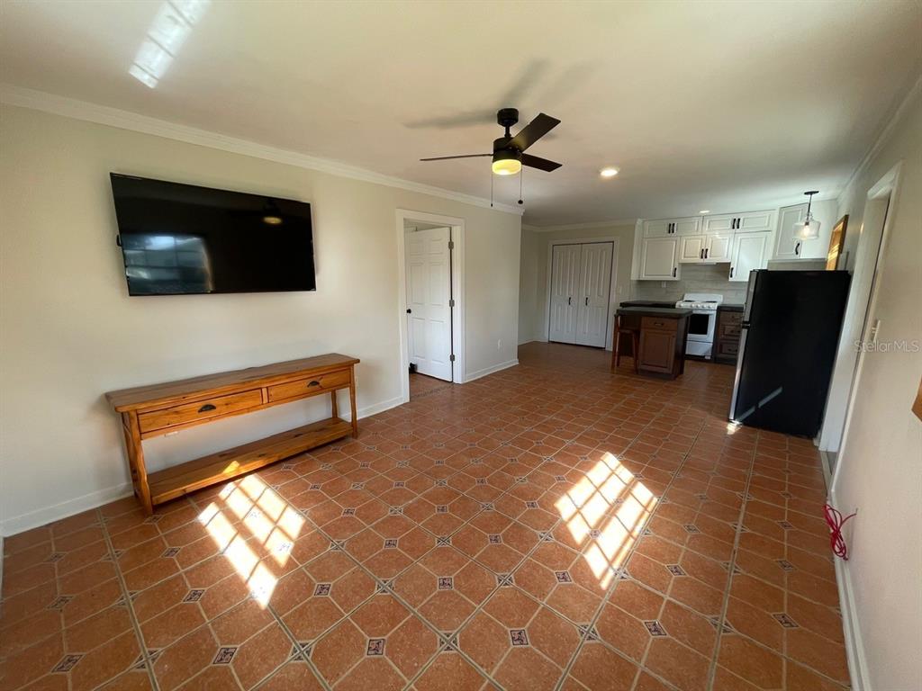 2309 Southwest 66th Street Ocala, FL 34476 - Photo 19 of 35 a living room with furniture and a flat screen tv
