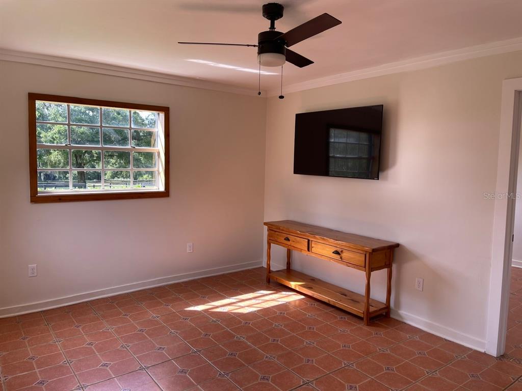 2309 Southwest 66th Street Ocala, FL 34476 - Photo 22 of 35 a room with furniture and a flat screen tv