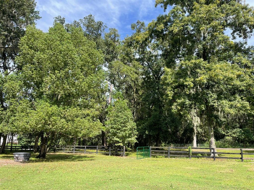 2309 Southwest 66th Street Ocala, FL 34476 - Photo 29 of 35 a view of a swimming pool with an outdoor space and seating area