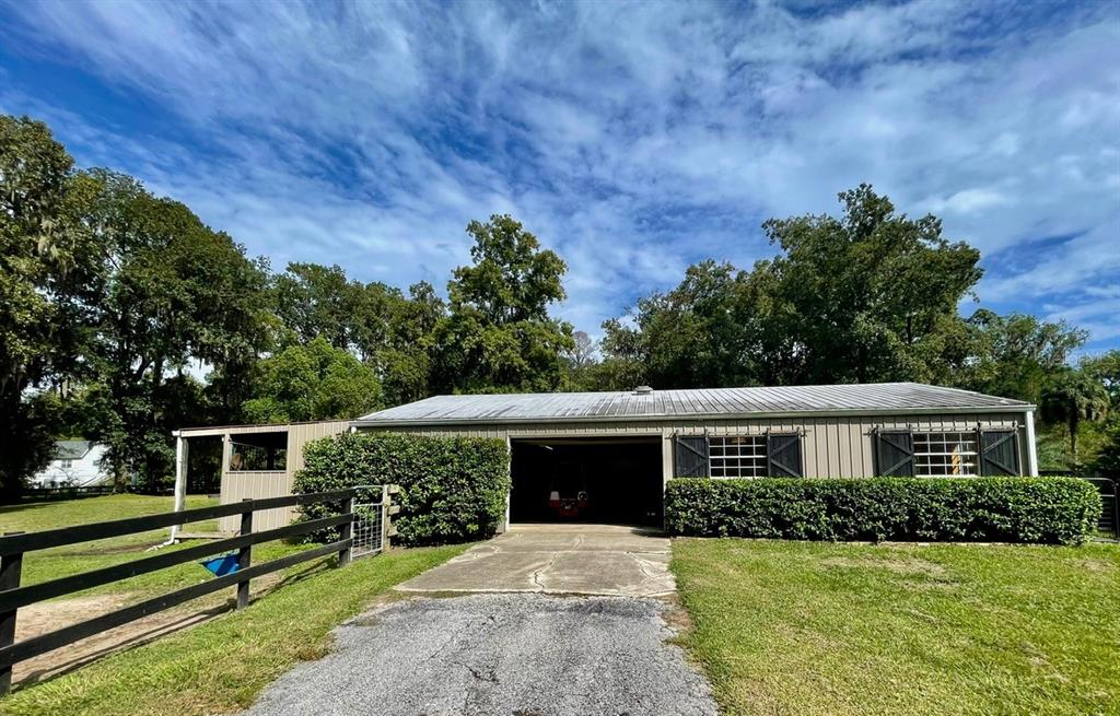 2309 Southwest 66th Street Ocala, FL 34476 - Photo 3 of 35 a front view of a house with a yard