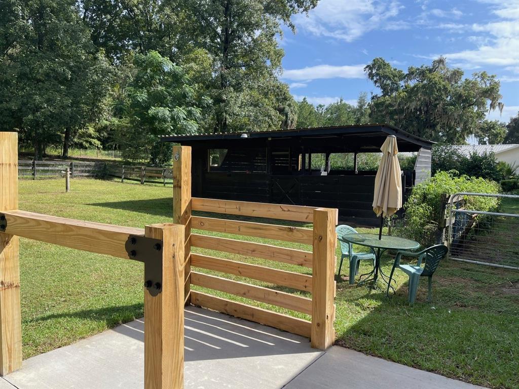 2309 Southwest 66th Street Ocala, FL 34476 - Photo 9 of 35 a view of a wooden fence and a big yard