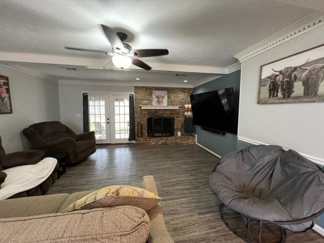 4405 Green Ridge Drive Columbus, GA 31909 - Photo 12 of 31 a living room with furniture ceiling fan and a fireplace