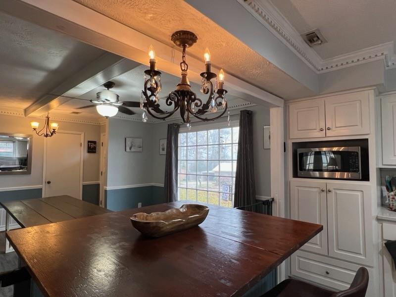 4405 Green Ridge Drive Columbus, GA 31909 - Photo 18 of 31 a living room with kitchen island furniture and a chandelier