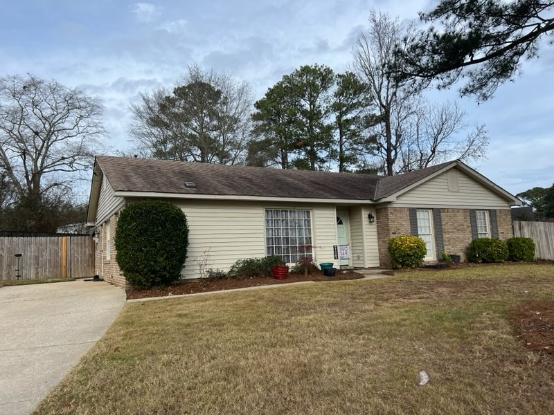 4405 Green Ridge Drive Columbus, GA 31909 - Photo 2 of 31 a front view of a house with a yard and garage