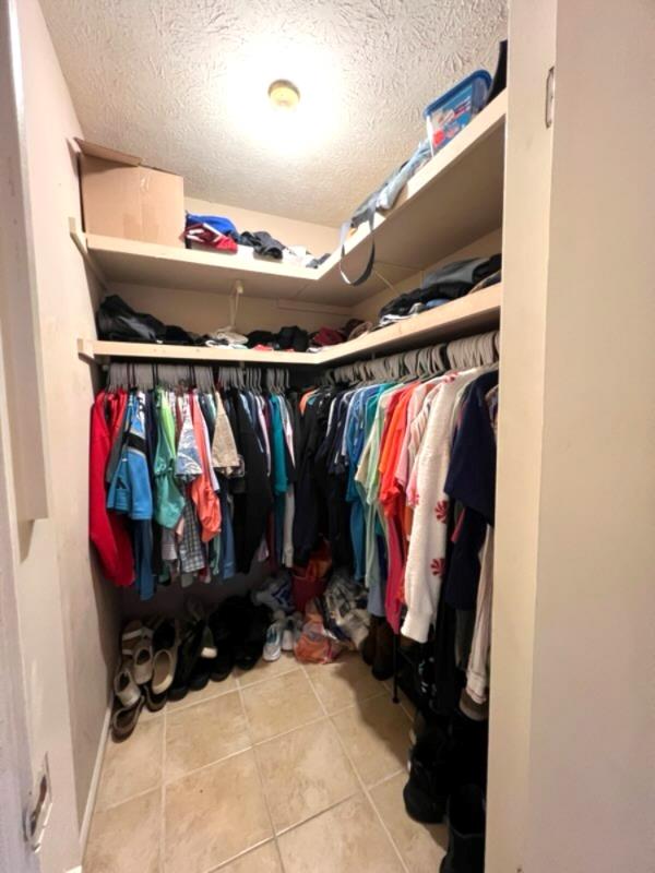 4405 Green Ridge Drive Columbus, GA 31909 - Photo 23 of 31 a view of walk in closet with clothes