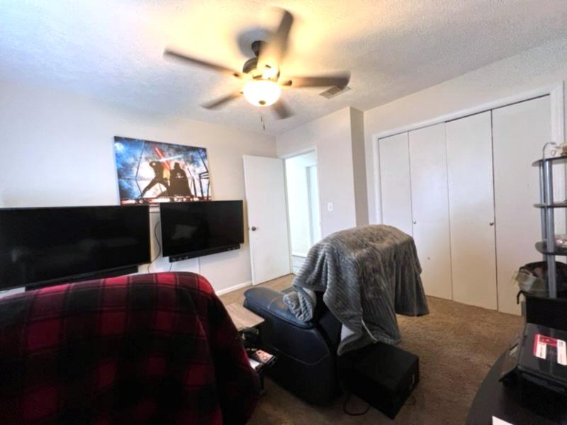 4405 Green Ridge Drive Columbus, GA 31909 - Photo 27 of 31 a living room with furniture and a flat screen tv