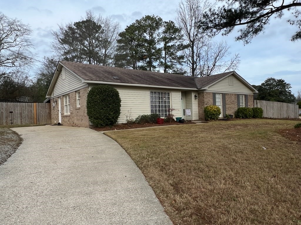 4405 Green Ridge Drive Columbus, GA 31909 - Photo 4 of 31 a front view of a house with a yard and garage
