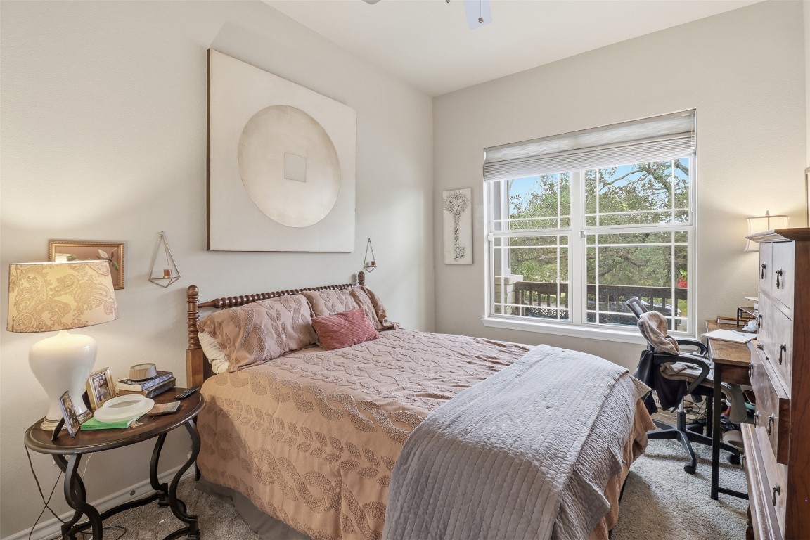 103 Kings Way Horseshoe Bay, TX 78657 - Photo 13 of 20 a bed sitting in a bedroom next to a window