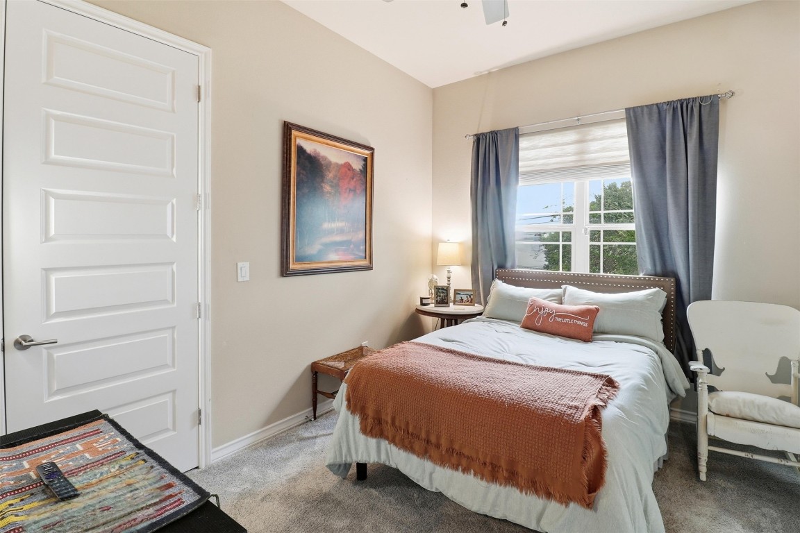 103 Kings Way Horseshoe Bay, TX 78657 - Photo 15 of 20 a bedroom with a bed and a window