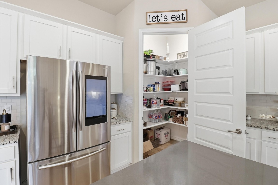 103 Kings Way Horseshoe Bay, TX 78657 - Photo 6 of 20 a kitchen with stainless steel appliances a refrigerator and cabinets