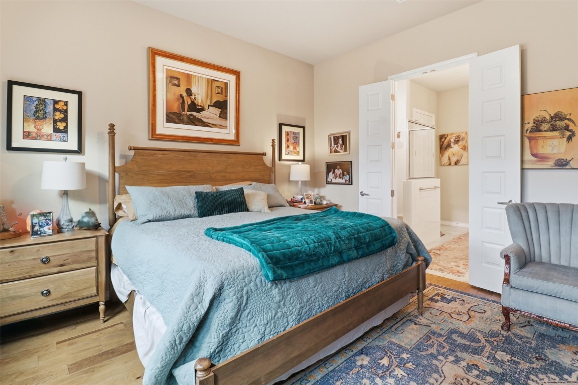 103 Kings Way Horseshoe Bay, TX 78657 - Photo 10 of 20 a bedroom with a bed and a couch