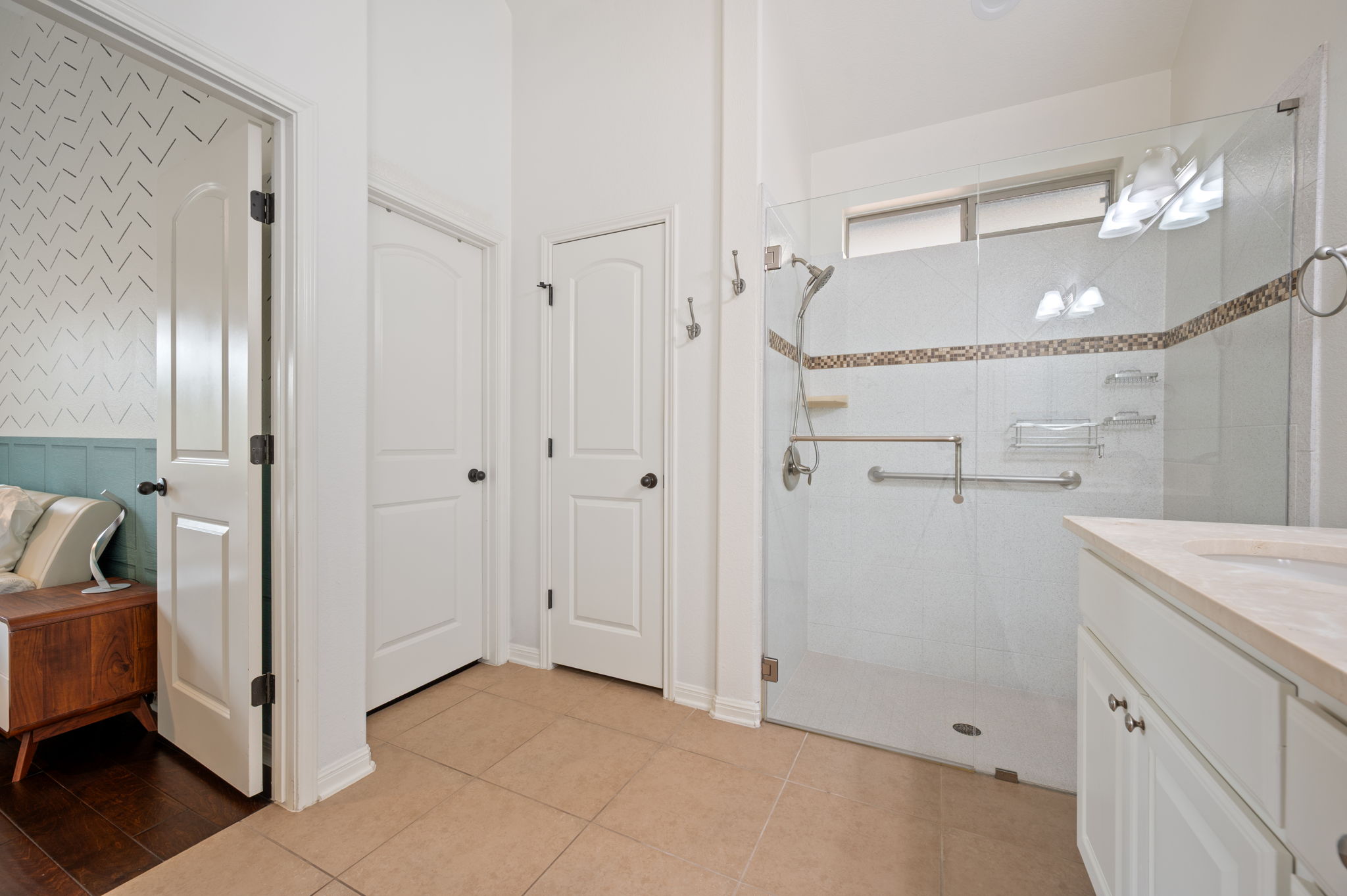 4220 Tambre Bend Austin, TX 78738 - Photo 19 of 28 Bathroom with vanity, a shower stall, and light tile patterned floors