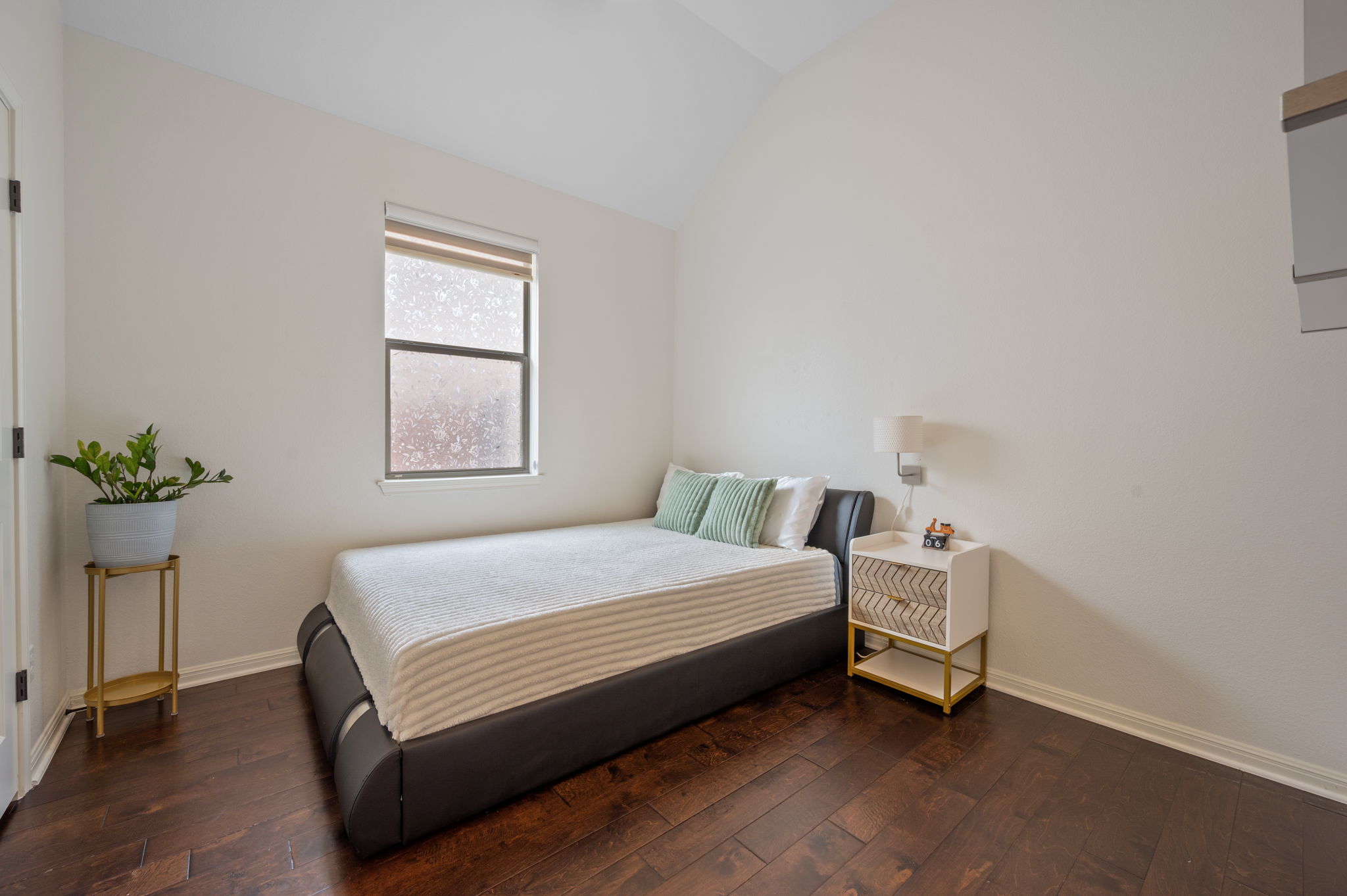 4220 Tambre Bend Austin, TX 78738 - Photo 22 of 28 Bedroom with vaulted ceiling and hardwood / wood-style flooring