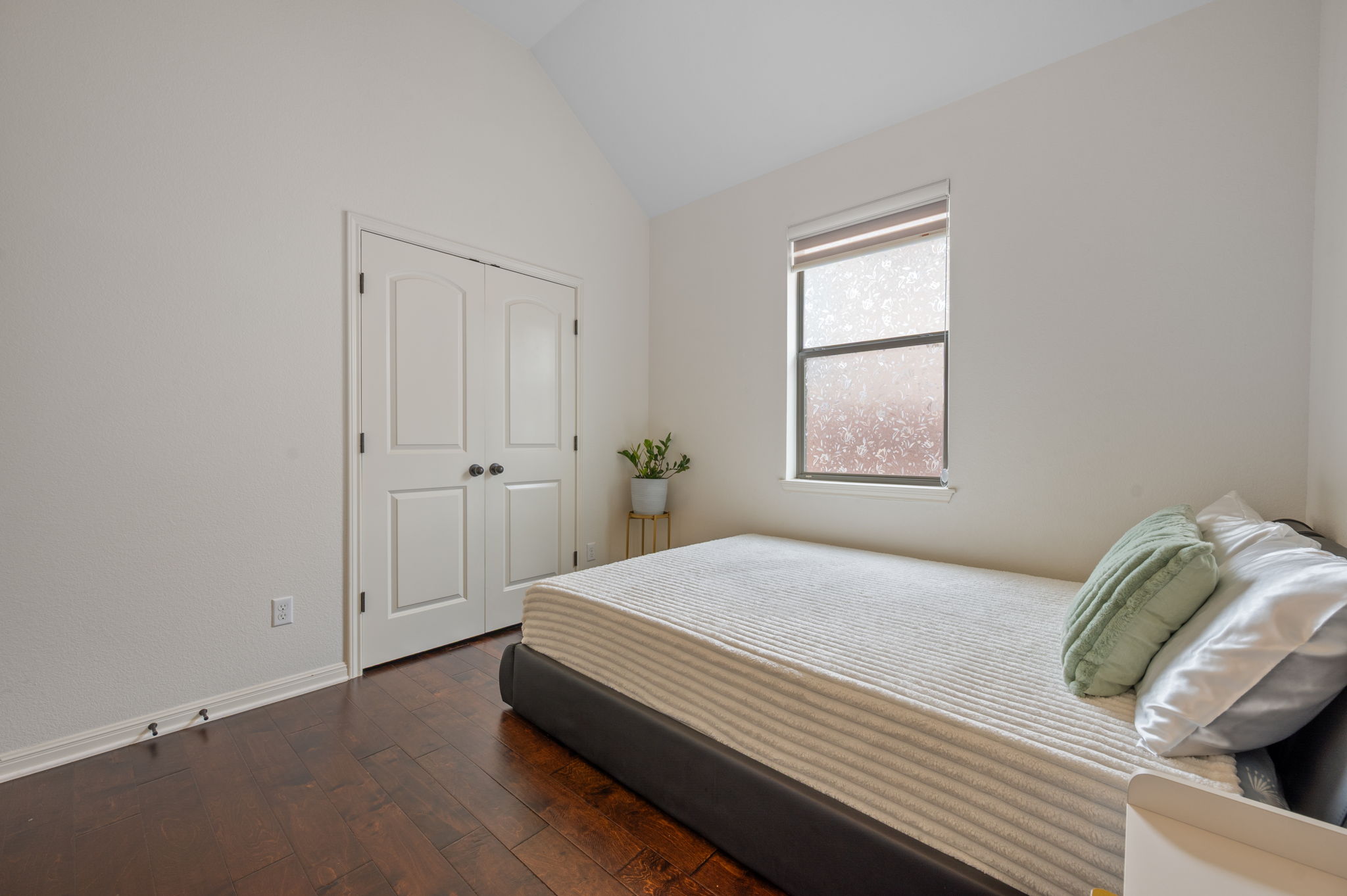 4220 Tambre Bend Austin, TX 78738 - Photo 23 of 28 Bedroom with dark wood-style flooring, vaulted ceiling, and a closet