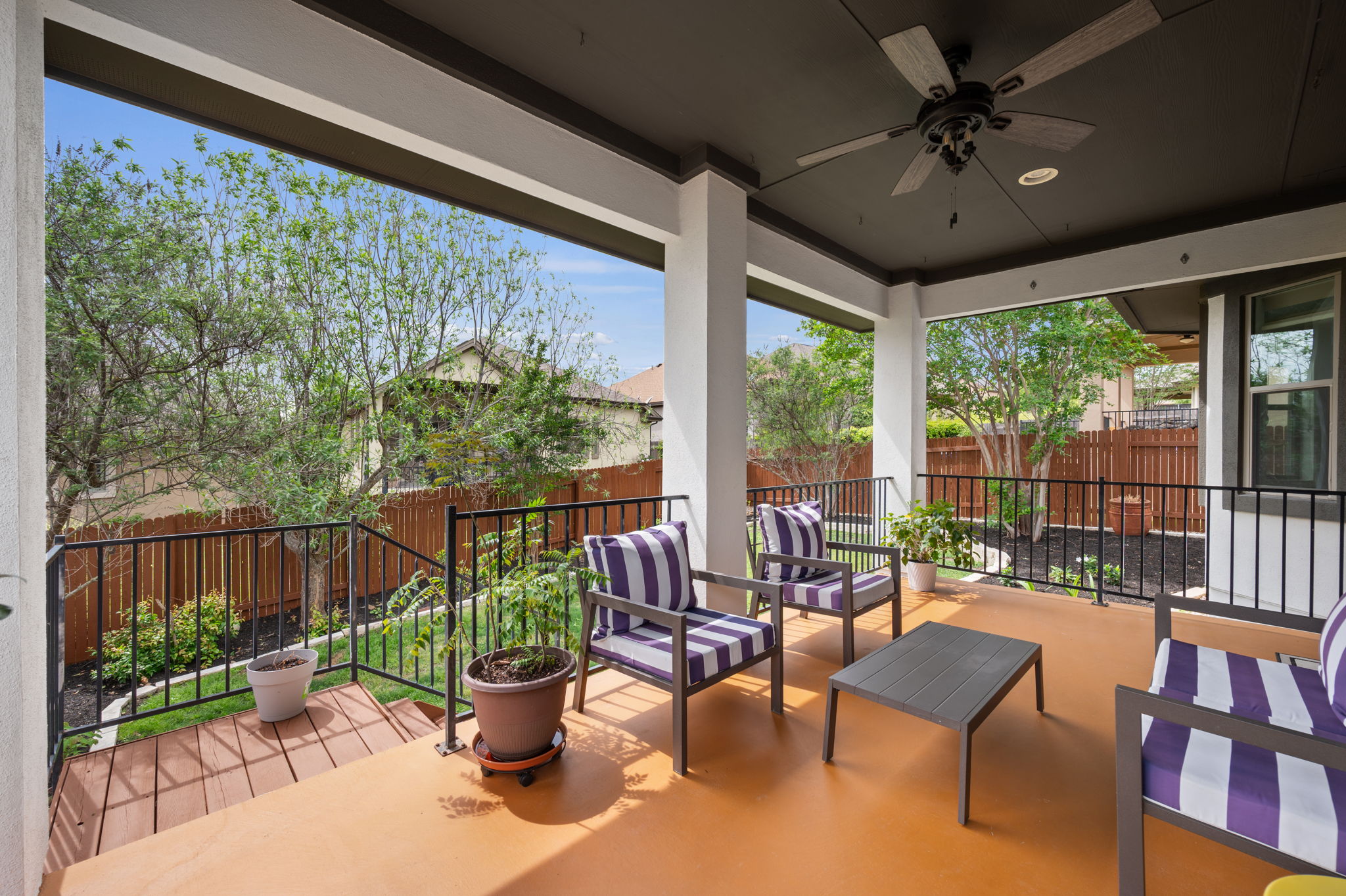 4220 Tambre Bend Austin, TX 78738 - Photo 25 of 28 Fenced backyard with ceiling fan, an outdoor living space, and a patio area