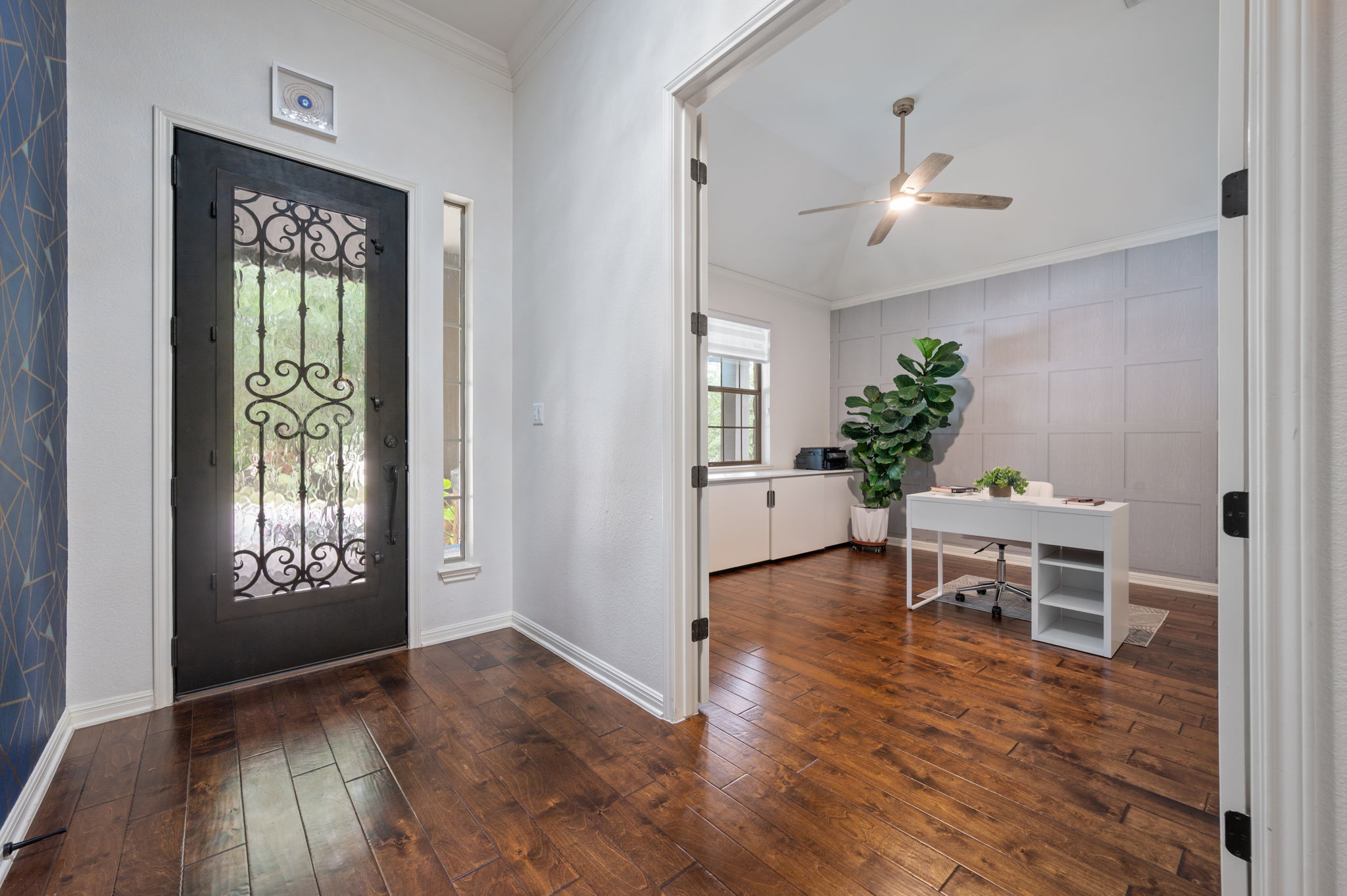 4220 Tambre Bend Austin, TX 78738 - Photo 4 of 28 Entrance foyer with ornamental molding, dark wood finished floors, and ceiling fan