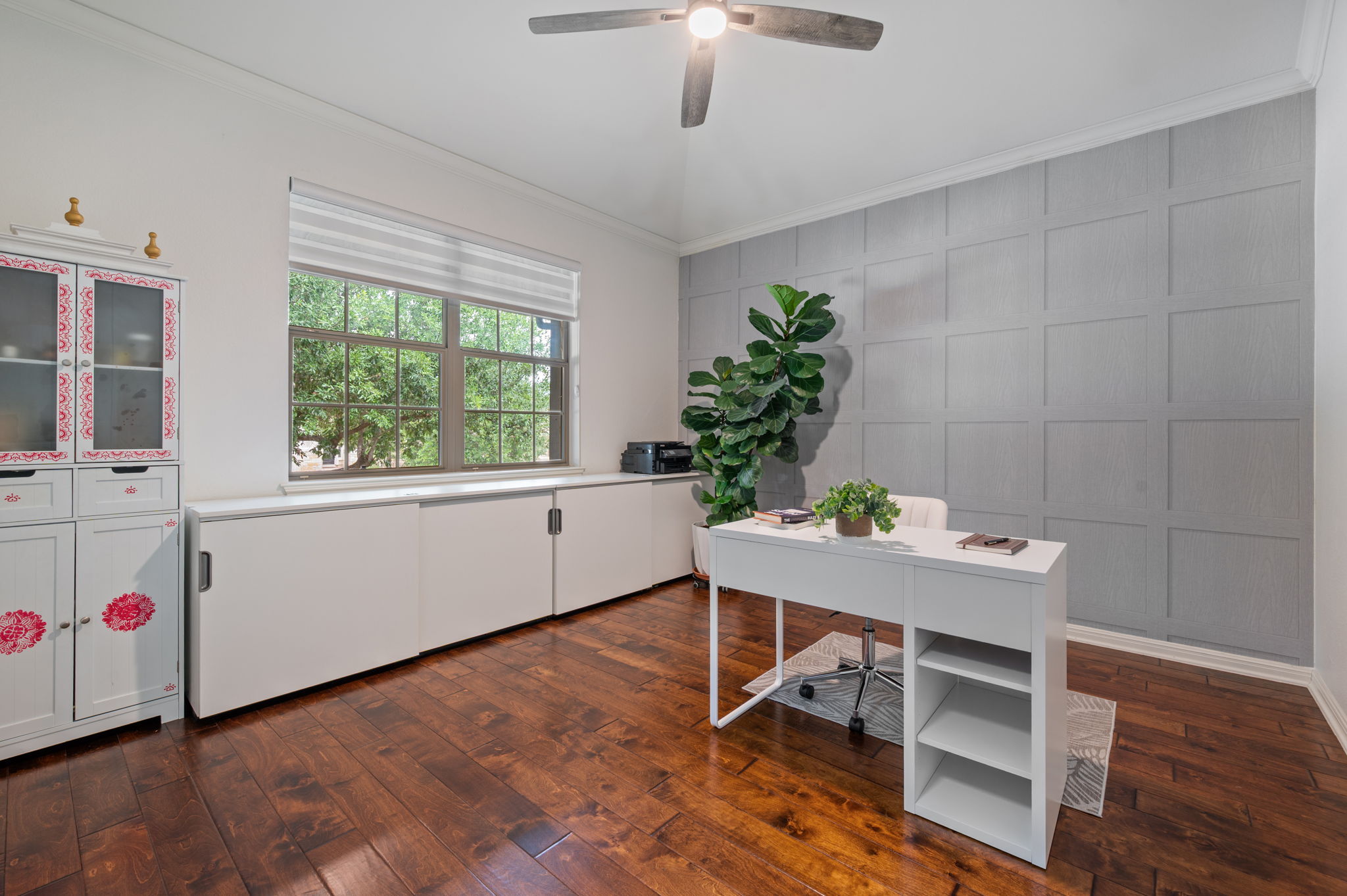 4220 Tambre Bend Austin, TX 78738 - Photo 5 of 28 Office area with a decorative wall, dark wood-style flooring, ceiling fan, and crown molding
