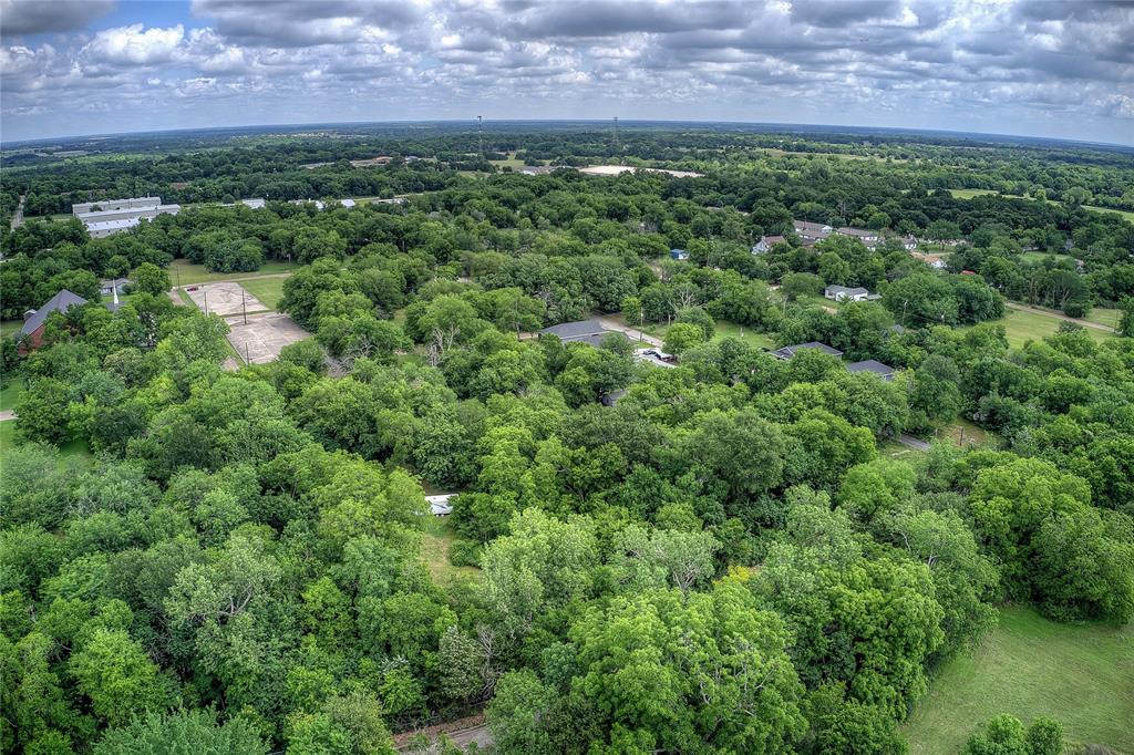0 Sycamore Street Commerce, TX 75428 - Photo 1 of 14 an aerial view of a house with a yard